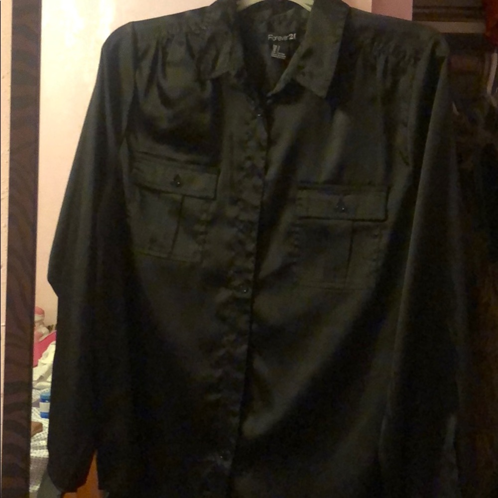 Silk button up shirt. Very classy.